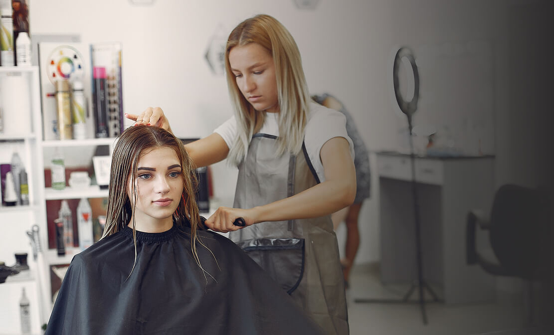 Woman drying hair hair salon